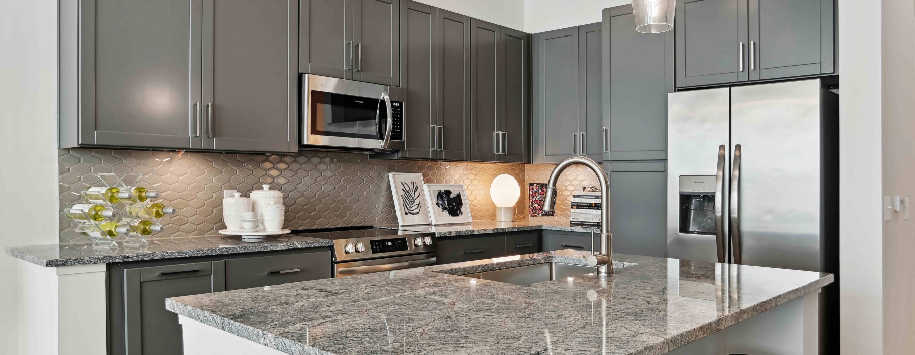 Kitchen with granite countertop island