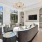 wall mounted television in clubhouse with oversized windows