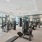 spacious fitness center with ample lighting throughout