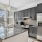 Kitchen with stainless steel appliances, dark cabinetry, large island
