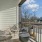 Balcony with seating and views connery on providence charlotte